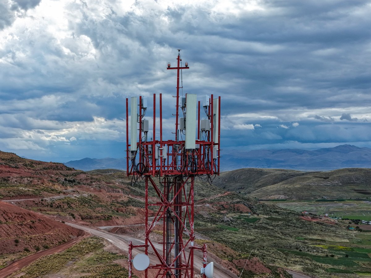 Telecommunications tower rising above an arid rural landscape